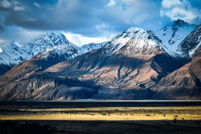 Scenic view of snowcapped mountains against sky