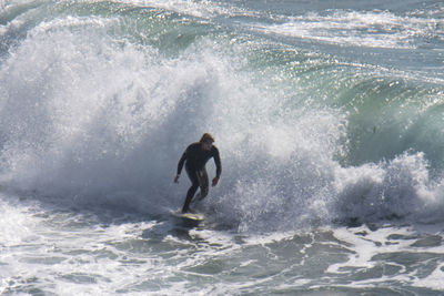 Man surfing in sea