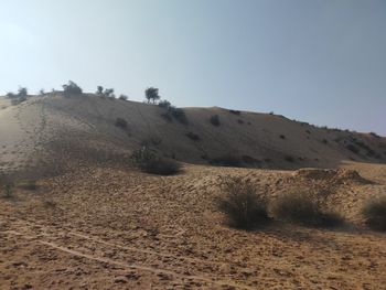 Scenic view of arid landscape against clear sky