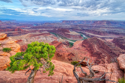 Scenic view of landscape against cloudy sky