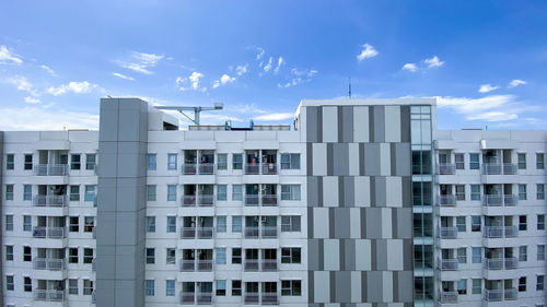 Low angle view of modern buildings against sky