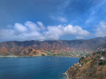 Scenic view of mountains against blue sky