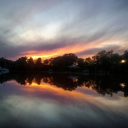 Scenic view of lake at sunset