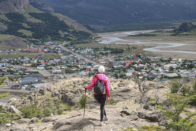 Rear view of woman walking on mountain