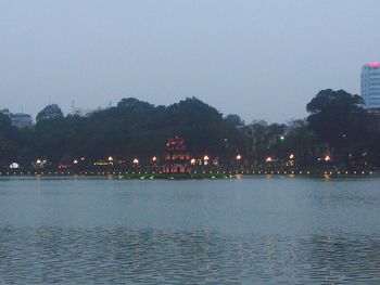 Reflection of trees in river at night