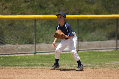 Little league baseball infielder ready for a ground ball