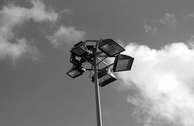 Low angle view of floodlight against sky