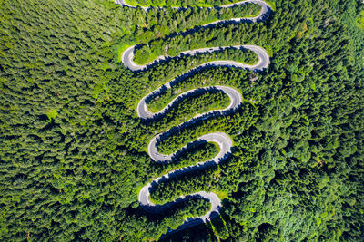 Aerial view of winding road during sunny day