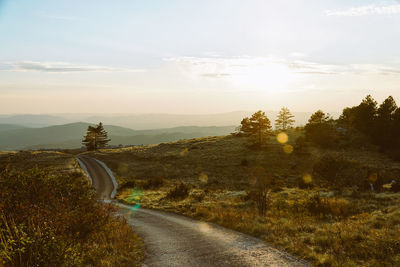 Scenic view of road on mountain against sky