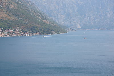 Scenic view of sea by mountains