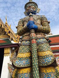 Low angle view of statue against building