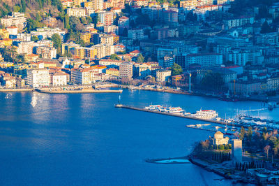 The city of como, the lake, the lakeside promenade, the buildings, photographed from above.