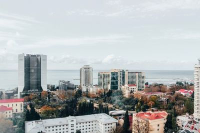 Buildings in city against sky