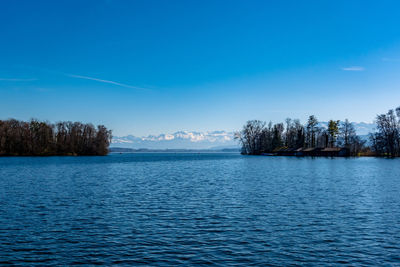 Scenic view of lake against blue sky