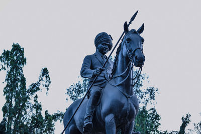 Low angle view of statue against clear sky