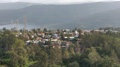 High angle view of townscape against mountains