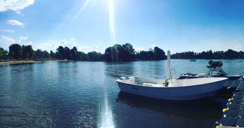 Panoramic shot of boats in calm lake