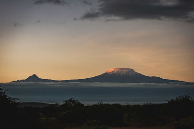 Scenic view of mountains against sky during sunset