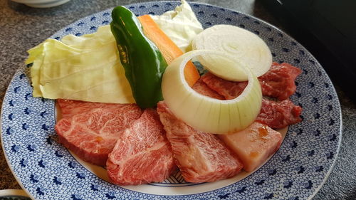 High angle view of fruits in plate on table