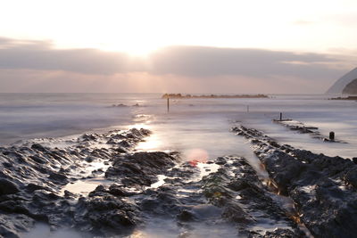 Scenic view of sea against sky during sunset