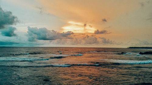 Scenic view of sea against sky at sunset