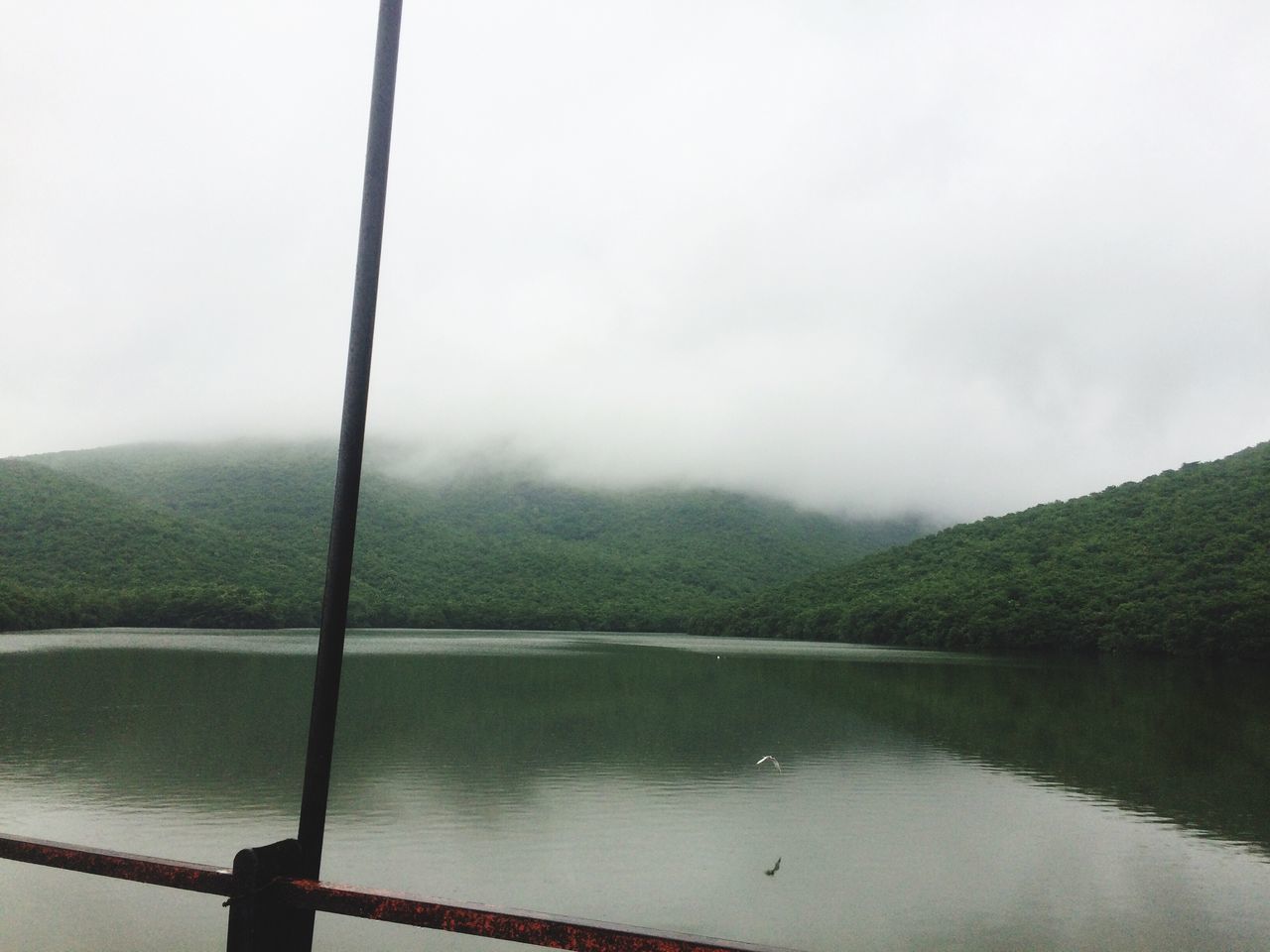 tranquil scene, lake, water, mountain, scenics, tranquility, beauty in nature, non-urban scene, fog, nature, sky, foggy, calm, countryside, vacations, day, tourism, waterfront, cloud - sky, remote, no people, journey