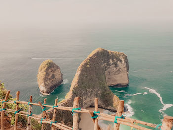 Panoramic view of rocks on beach against sky