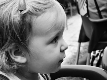 Close-up of cute girl looking away