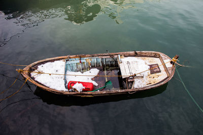 High angle view of boat moored in lake