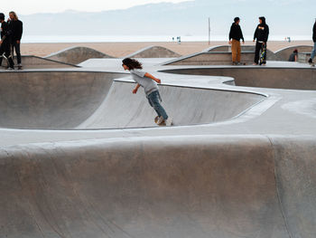 Rear view of man skateboarding