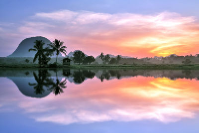 Scenic view of lake against sky during sunset