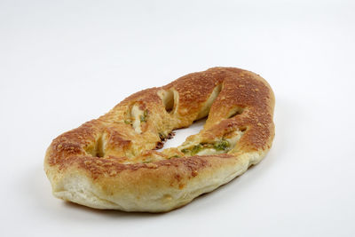 Close-up of bread against white background