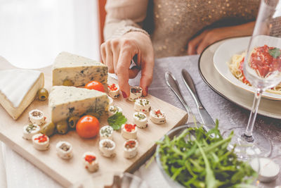 Midsection of woman preparing food