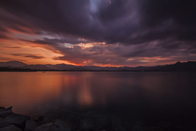 Scenic view of lake at sunset