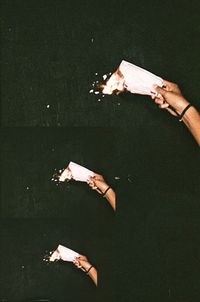 High angle view of hand holding cigarette