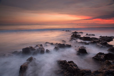 Scenic view of sea against sky during sunset