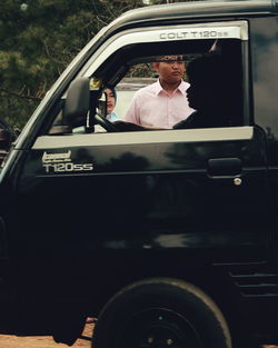 Portrait of a man in car