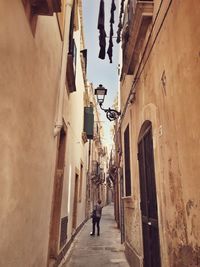 Alley amidst buildings in city