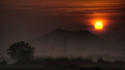 Scenic view of silhouette landscape against sky during sunset