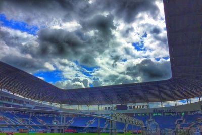 Low angle view of building against cloudy sky