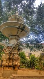 Low angle view of statue against building