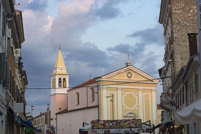 Low angle view of buildings against sky in city