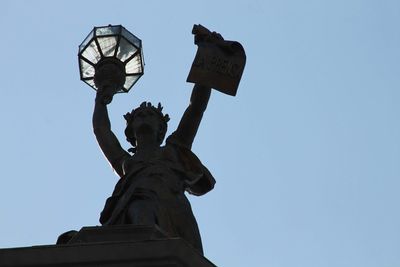 Low angle view of statue against clear sky