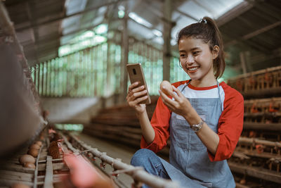 Young woman using mobile phone