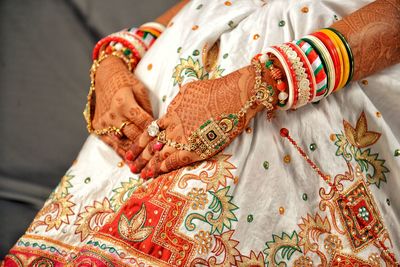 Close-up of bride wearing jewelry