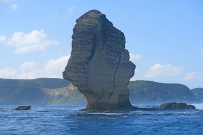 View of statue with sea in background