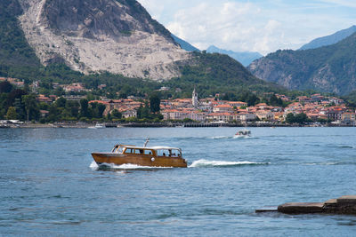 Scenic view of sea and mountains against sky