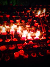 Close-up of illuminated candles in temple