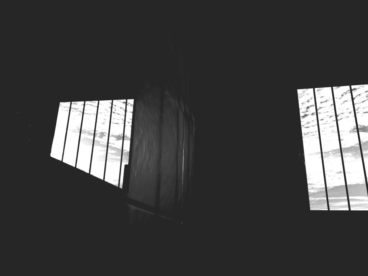 window, architecture, indoors, no people, building, built structure, day, copy space, sunlight, dark, domestic room, glass - material, low angle view, silhouette, pattern, nature, darkroom, transparent