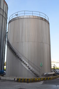 Low angle view of factory against sky